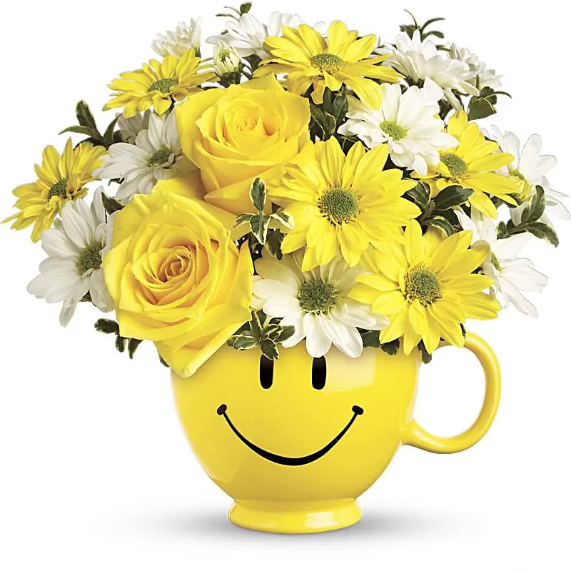 Teleflora Be Happy Bouquet with yellow roses and daisies in a smiley mug