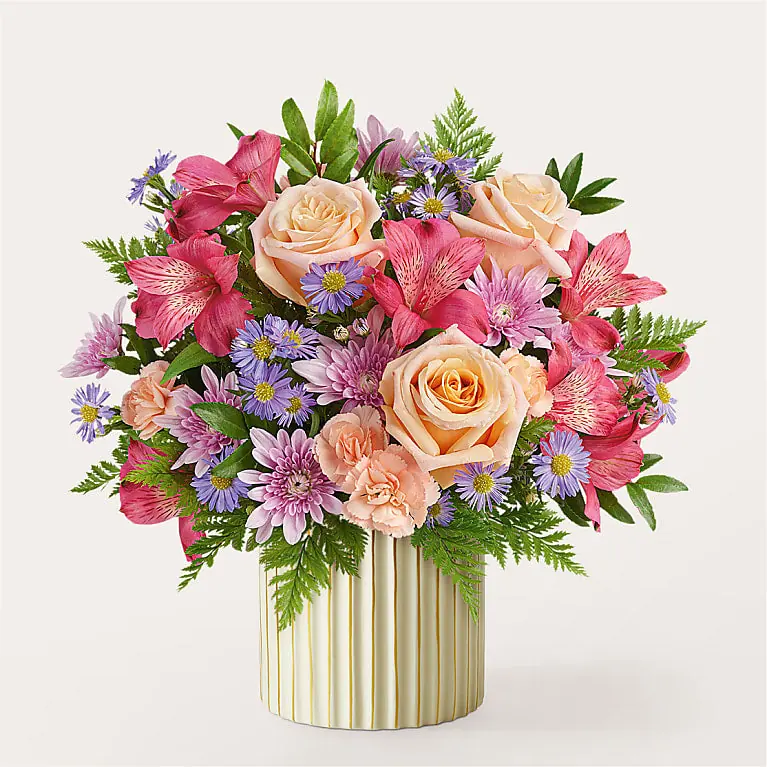 Sunset Serenade Bouquet from ProFlowers with peach roses and lavender flowers