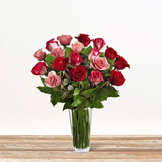 Red and pink rose arrangement from The Bouqs Co. in a glass vase